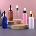 Luxury Anodized PET Amber Essential Oil Serum Plastic Dropper Bottle 50ml Stock Empty Bottles Lotion 30ml Plastic Packaging