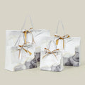 MU PACKING Fashion Bow Hand Garment Bag Gift Marble Embossed Art Paper Bag With Handles Shopping