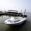 Six-person Aluminum Speedboat for Rainforest Patrol and Fishing with Storage Seats and a Windshield.