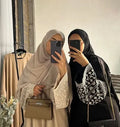 LM084 Exquisite Daisy-Embroidered Linen-Like Maxi Abaya Dress Closed with an Accent Belt Showcasing Modest Elegance