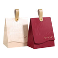 Customizable Folding Gift Paper Bags with Embossed Letters Wholesaler Bag Packaging Kraft Paper Leather Handle