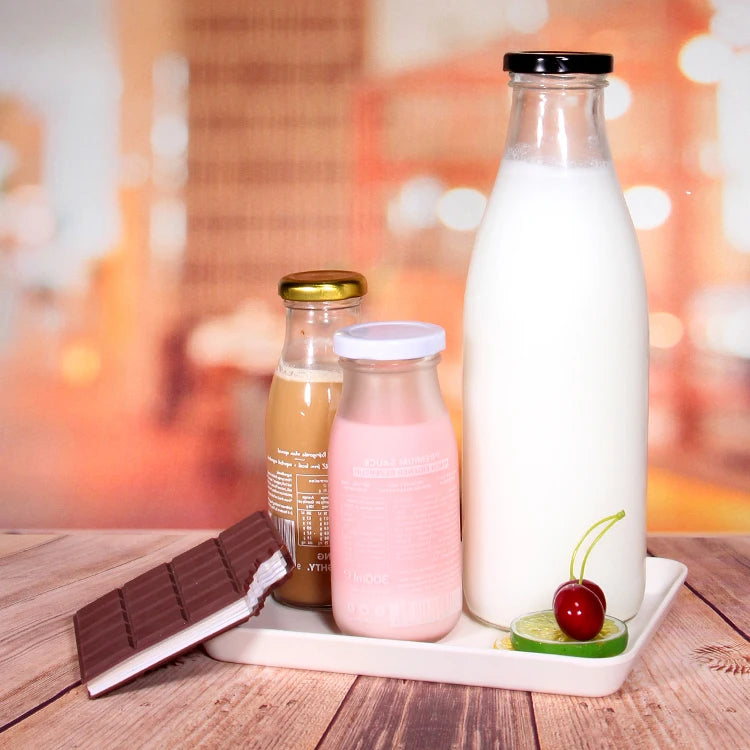 Stocked Cheaper Price Round Clear Transparent Milk Bottle Glass for Juice Beverage Packaging