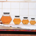 Customise Elegant Unique Luxury Hexagon Bottle Packing Glass Honey Jar With Lids