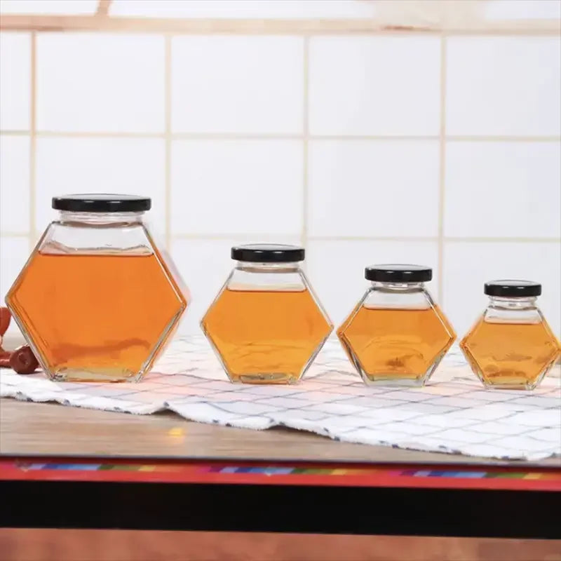 Customise Elegant Unique Luxury Hexagon Bottle Packing Glass Honey Jar With Lids