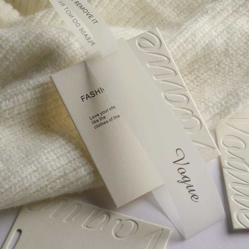 Wholesale Cheap Fashion Luxury Clothing Tags Luxury Custom 3D Relief logo Gold Stamping Ready to Wear Plastic Label