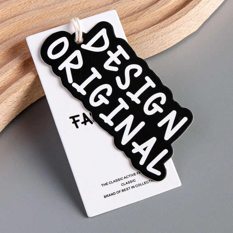Custom Luxury Biodegradable Kraft Paper Embossed Clothing Hangtags String Pink Designer Swing Tag Eco Shirt Tags Brand Tag