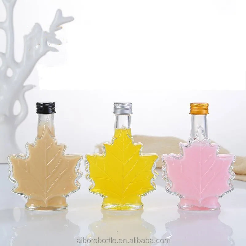 Unique Clear Maple Leaf Shape Syrup Glass Bottle 50ml 100ml 250ml Capacity with Screw Lid for Water Tequila Brandy Packaging