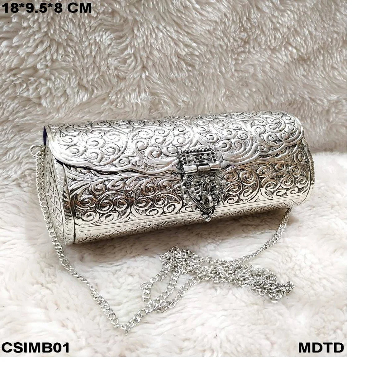 Custom made elegant handcrafted metal embossed clutches with intricate designs for weddings parties gifting & boutique resale.