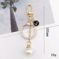 New Fashion Camellia Keychain Elegant Enamel Flower Keychain With Pearl for Women Bag Car Key Pendant Cute Keychain