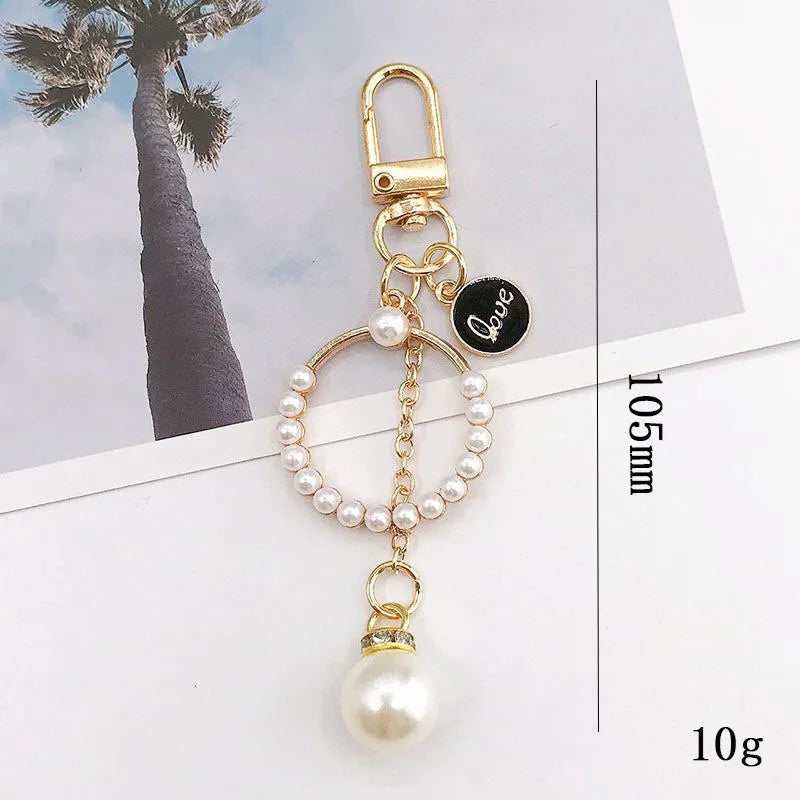 New Fashion Camellia Keychain Elegant Enamel Flower Keychain With Pearl for Women Bag Car Key Pendant Cute Keychain