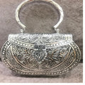 custom made brass embossed and engraved metal clutches for fashion accessory stores for resale