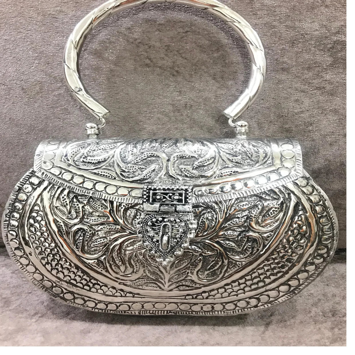 custom made brass embossed and engraved metal clutches for fashion accessory stores for resale