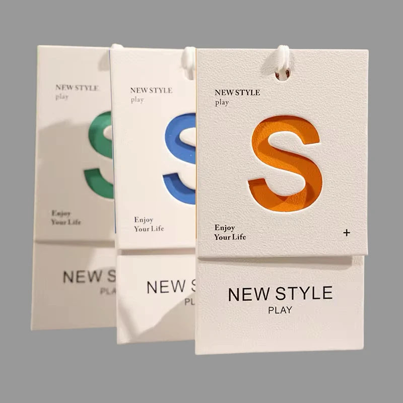 FSC Certified Custom Luxury Logo Hollow Out Garment Hang Tags Paper Clothing Swing Tags with Luxury Finish for Clothing