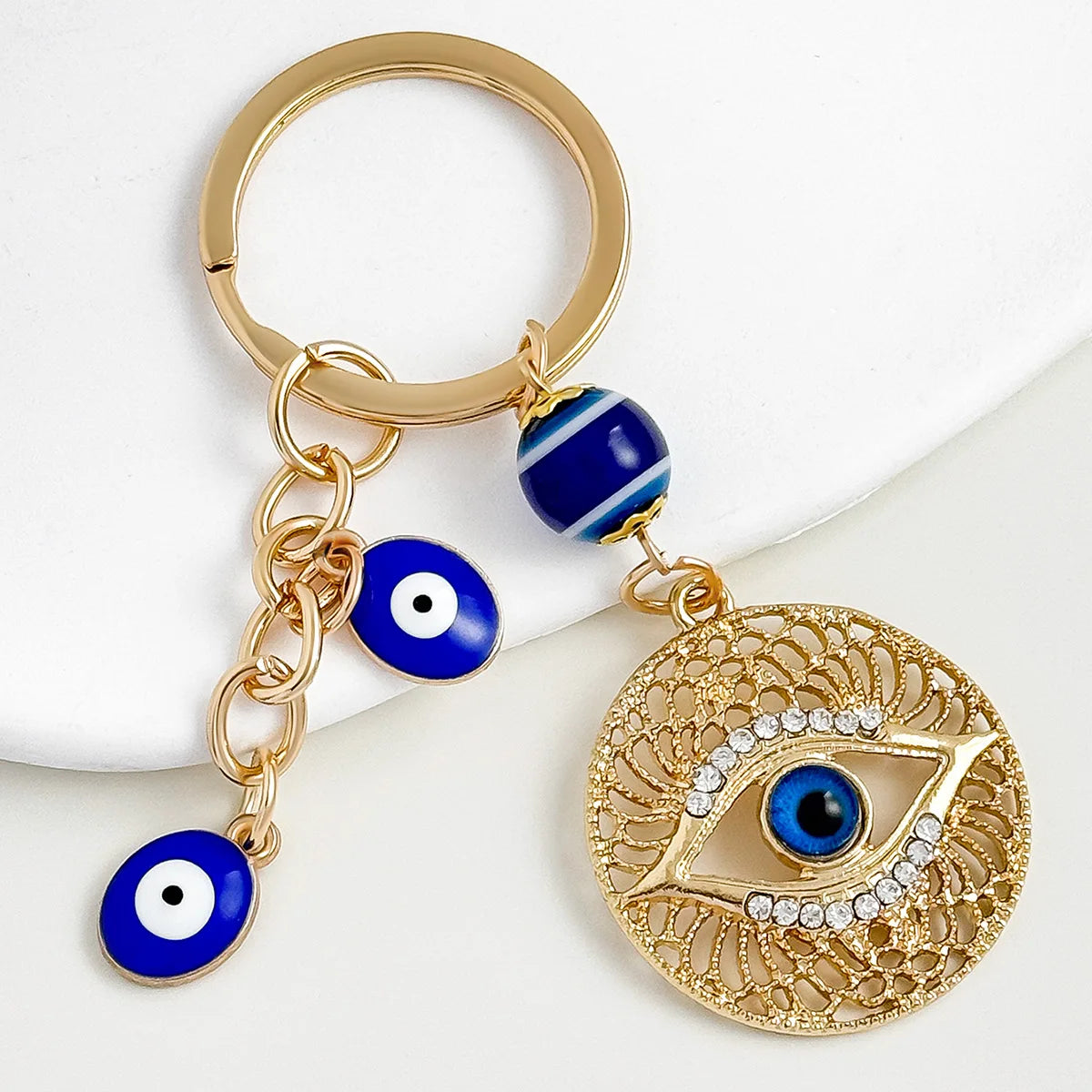 One Piece Blue Eyes Devil's Eye Tassel Alloy Plated Keychain Brilliant Diamond Style Carabiner Pendant Accessory for Bags