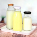 Wholesale Milk Bottle With Custom Logo Lid Milk Coffee Beverage Drink Empty Juice Bottles