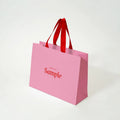 Luxury Custom pink Retail Boutique Shopping Paper Gift Bag Cardboard Packaging Bags with Your Own logo Print Handle