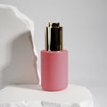 Cosmetic 30ml 20ml 50ml Round Pink Clear Face Serum Essential Oil Bottle Push Button Glass Dropper Bottle With Box