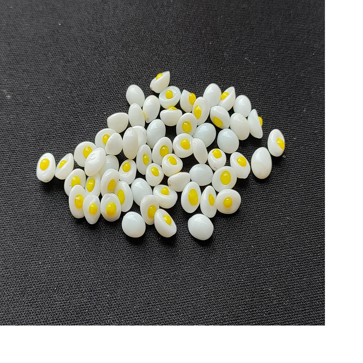 Custom made chicken egg themed glass bead exclusively made for various purposes available in sizes for reselling purposes.