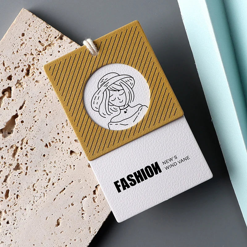 Low Moq Custom Eco Recyclable Luxury Logo With String Rope Swing Tag Embossed Black Uv Printing Paper Hang Tag for Clothing
