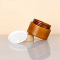 Wholesale 50ml 150ml 250ml 500ml Amber Matte Plastic Jars with Bamboo Lid Round Shape Cosmetic Cream Jar