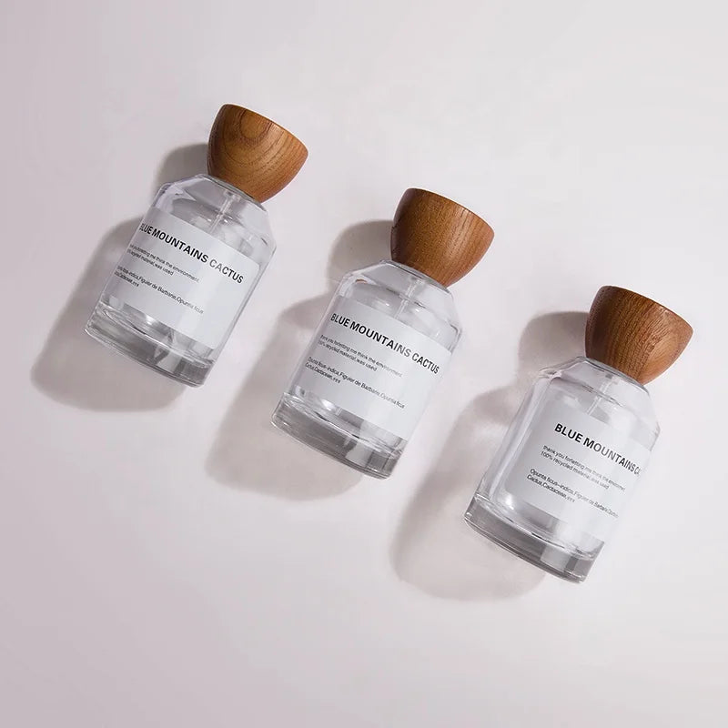 Empty High Quality Cylinder Transparent Oem Glass 50 Ml Perfume Bottle With Wooden Cap Gift Box Pump Sprayer