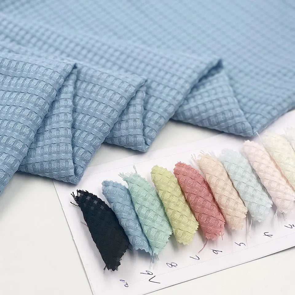 Wholesale Stock Woven Spun Jacquard Pure Color Plain Dyed Dobby Soft 100 Polyester Fabric for Women Clothing