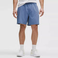 Men's Solid Athletic Fit Lightweight 7" Lined Mid Waist Quick Dry Breathable Shorts with Zippered Pockets