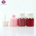 Yueshunxing 8ml Special Shape Latest Mini Cute Kids Custom logo pink Plastic Packaging Bottle White Lid Lip Gloss Tube