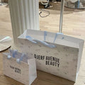 Shopping Gift Bags Customized for logo Recycled White Coated Paper Bag with Cloth Handle