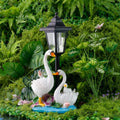 Solar Powered Swan Family Resin Sculpture with LED LampWhite Swans on Blue Base with Lotus LeaveOutdoor Garden Decor for Yard