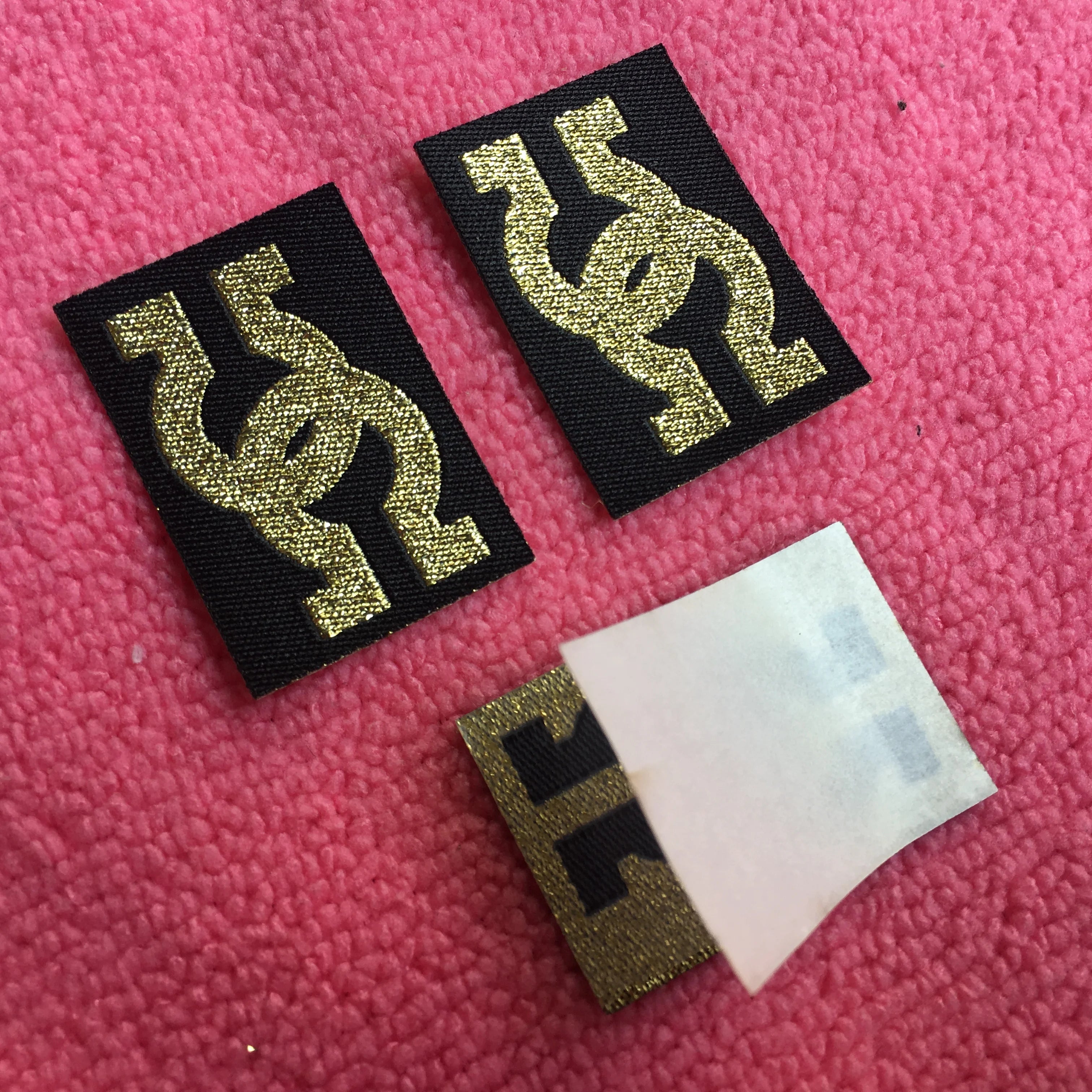 Laser Cut Iron on Fabric Label With Gold LogoWashable Private logo Gold Metallic Woven Label With Sticky Backing