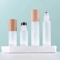 Luxury Wood Cap Metal Roller Essential Oil Bottle 5ml 10ml Refillable Empty clear Frosted Round Glass Perfume Roller Bottle