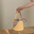 2026 Summer Fashion Women's Trendy Handmade Cute Straw Woven Waterproof Bucket Bag Luxury Polyester Lining Logo Knotted Handbag