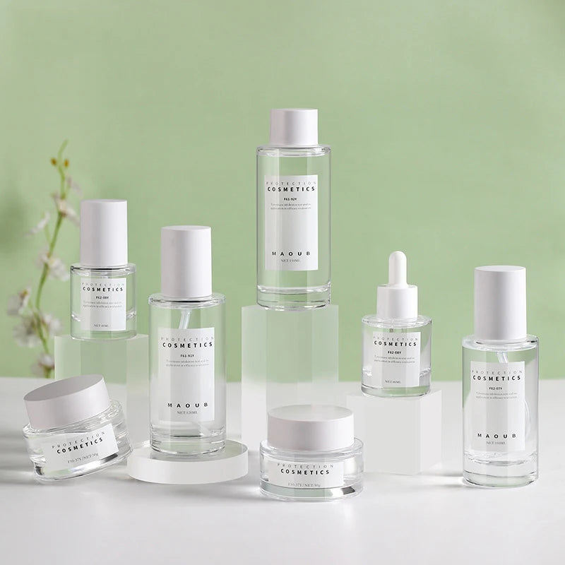 Customized High-End Glass Makeup Skin Care Packaging Set Frosted Pressure Pump Spray Dropper Glass Bottle and Cream Jar