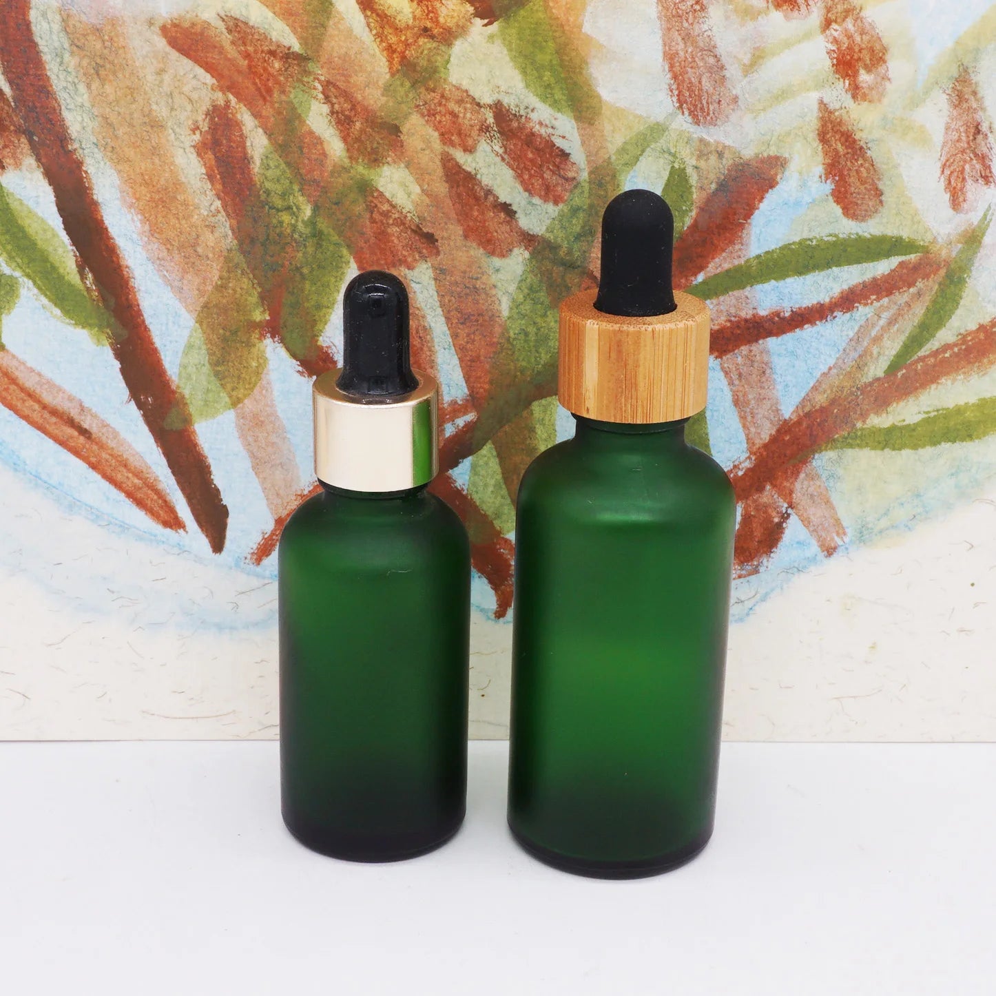 50ml 100ml Empty Round Cosmetic Frosted Green Essential Oil Dropper Bottle with Bamboo Cap