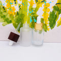 Flat Shoulder clear Cosmetic Glass Essential Oil Bottle with Black Wooden Lid