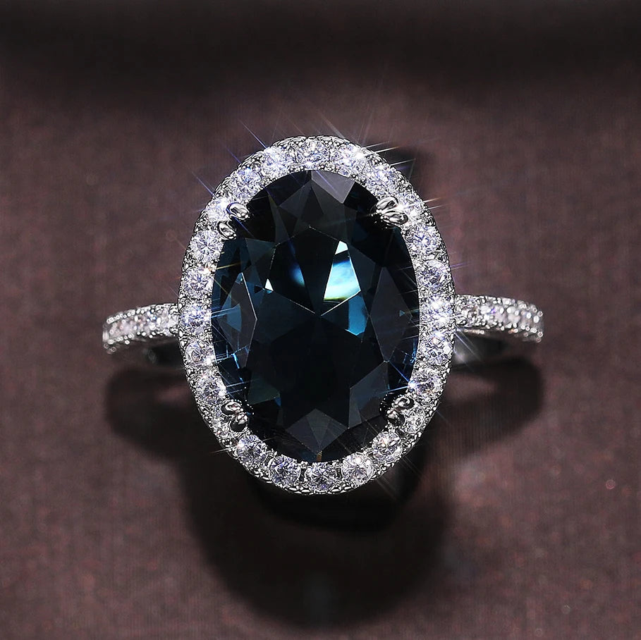 Huitan Customized Noble Hollow Anillos Woman Super Large Oval Pure Royal Blue Gemstone Macro Pave Zircon Luxury Silver Rings