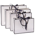 Wholesale Customize Cheap Price Eco-friendly White Black Brown Kraft Gift Paper Shopping Bag With Your Own Logo