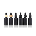 High Quality Empty 30ml Personal Care Cosmetic Package 1oz Black Glass Dropper Bottle for Skin Care Essence Essential Oil