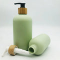 Luxury Green Color Cosmetic Packaging Bottles 8oz 16oz  Matte Green Shampoo Body Lotion Cleansing Oil Bottle with Bamboo Pump