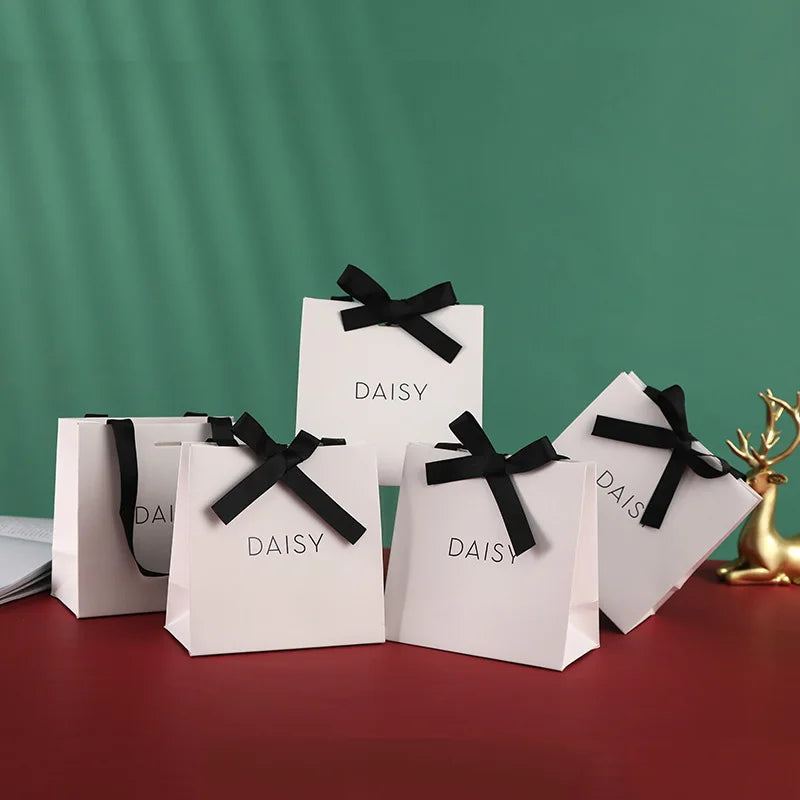 Luxury White Kraft Paper Bag with Ribbon Handle Offset Printing Surface for Jewelry and Door Gifts Watch Use