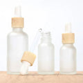 Free Sample Cosmetic Stock 10ml 15ml 20ml 30ml 50ml Skincare Essential Hair Oil Bottle Frosted Clear Glass Bamboo Serum Bottles