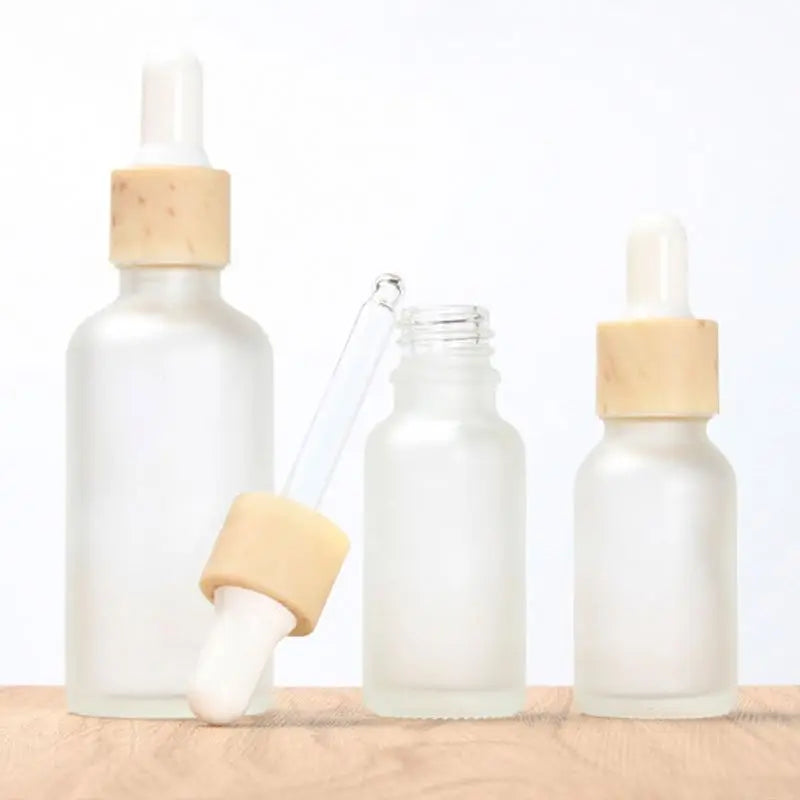 Free Sample Cosmetic Stock 10ml 15ml 20ml 30ml 50ml Skincare Essential Hair Oil Bottle Frosted Clear Glass Bamboo Serum Bottles