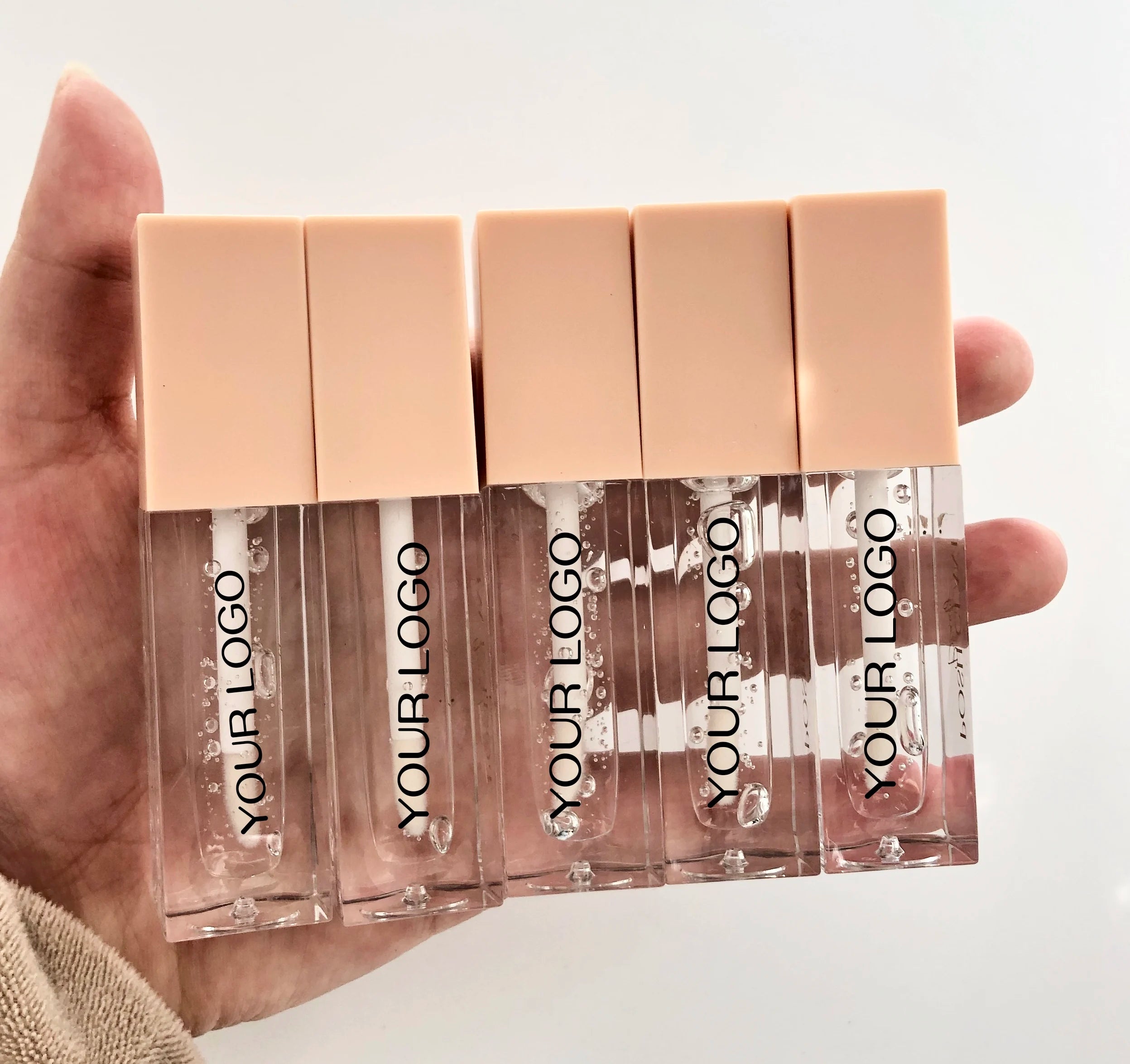 Private Label High Pigment Long-lasting Herbal Mineral Liquid Plumping Waterproof Lip Glaze Glossy Beige Tube Clear Lip Sample