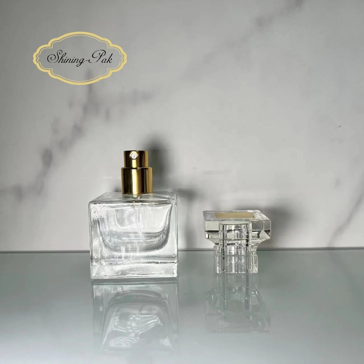 Wholesale 30ml Square Unique Empty Perfume Glass Bottle Flat Shape with 15mm Neck Size and Pump Sprayer Seal