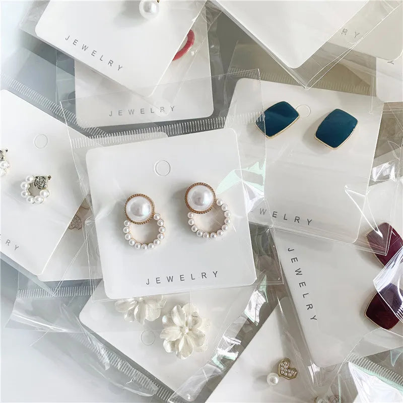 Wholesale Silver Needle Earrings - 50 Random Styles Assorted Designs Suitable for Night Market Stall Ear Studs