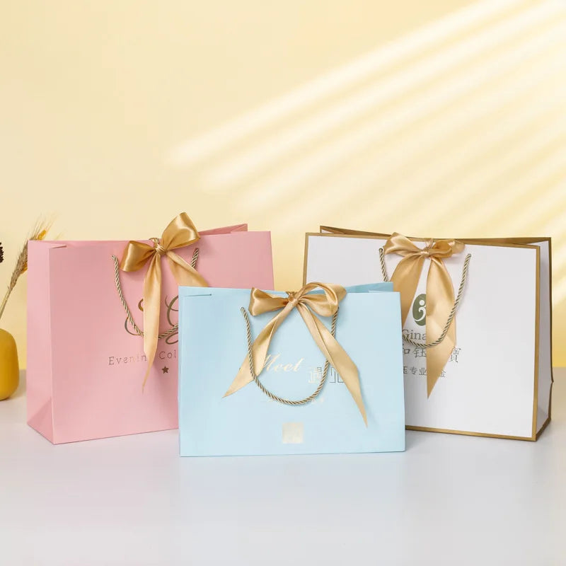 Oem&Odm Luxury Clothing Handbag Paper Bag Wholesale Bow Gift Shopping Bag Solid Color Packaging Bag Can Print Logo