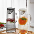 Newly Designed Custom Logo Heat Resistant Borosilicate Glass 1300ml Eco-Friendly Hot/Cold Water Pitcher with Mixing Spoon
