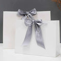 Custom Eco-Luxury Kraft Paper Shopping Bags With Printed Brand Logo Supplier Designs Ribbon Bow Fancy Packaging