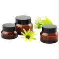 New Product 5g 10g 15g 20g 30g 50g 100g clear Amber Blue Green Matte Frosted Black Coloured Round Pots Glass Cosmetic Cream Jars